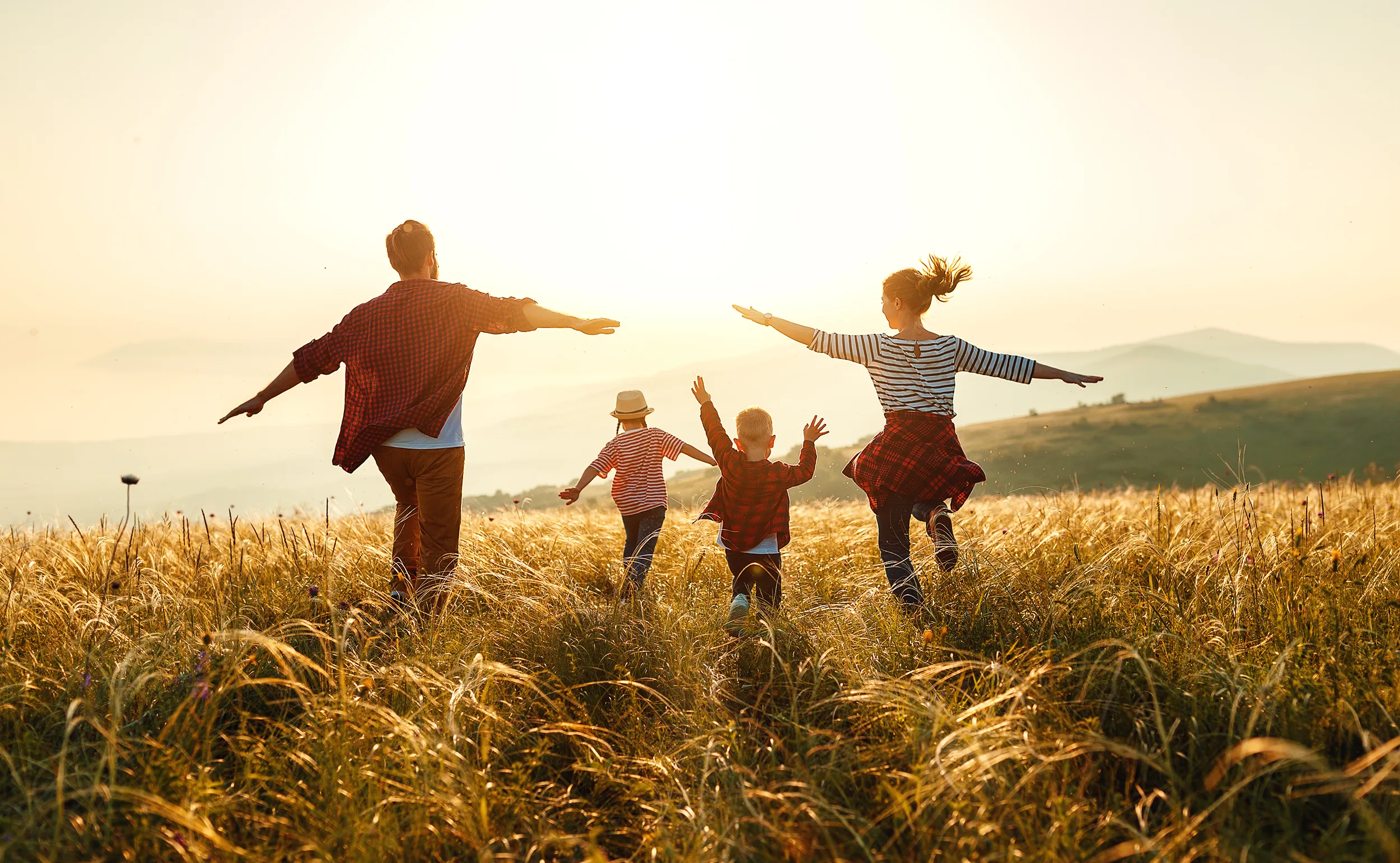 Family Running through a field